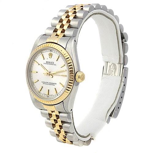 The Rolex Mid-Size 67513 Women's Stainless Steel Silver Dial 67513 Women's Stainless Steel Silver Dial watch is shown at an angled side view, highlighting its two-tone band, bezel, and face.