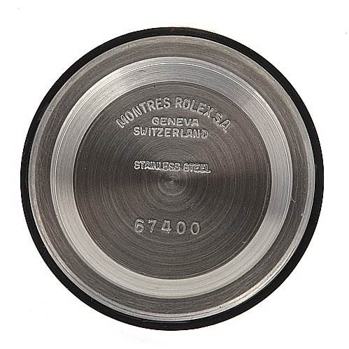 This image shows the case back of a Mid-Size Rolex watch, displaying "MONTRES ROLEX S.A.," "GENEVA SWITZERLAND," "STAINLESS STEEL," and the number "67400."