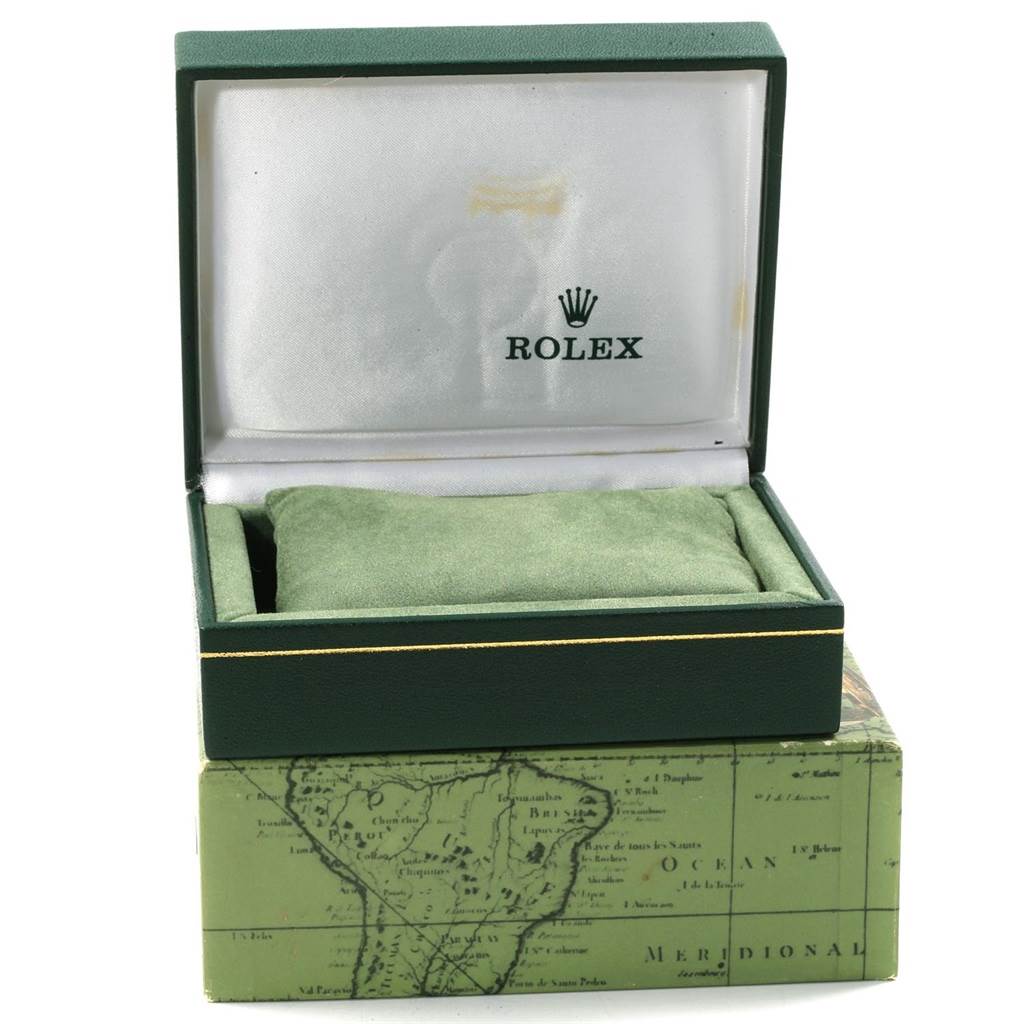 This image shows an open green box for a Mid-Size Rolex watch with a map design on the outer box.