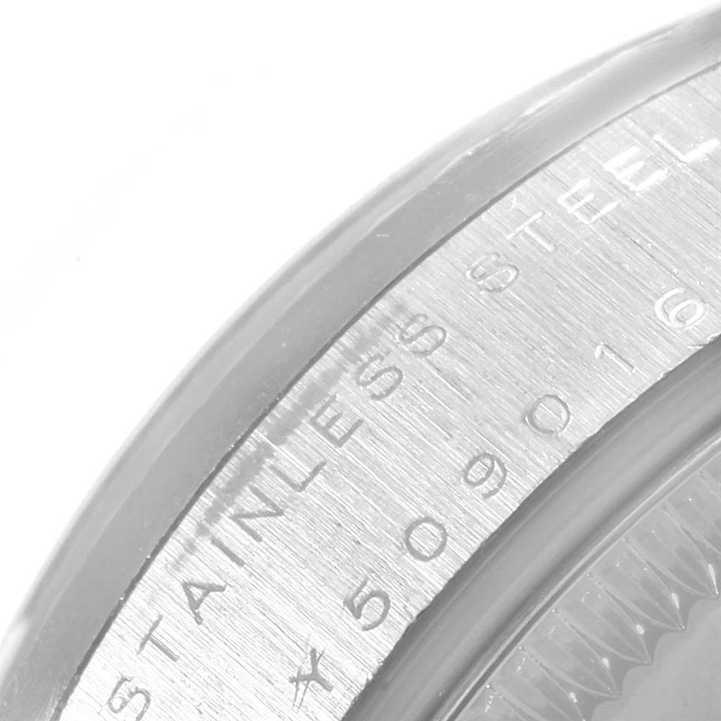 The image shows a close-up of the stainless steel case back with engraved text of a Rolex Mid-Size 78274 Women's Stainless Steel Silver Dial 78274 Women's Stainless Steel Silver Dial model watch.