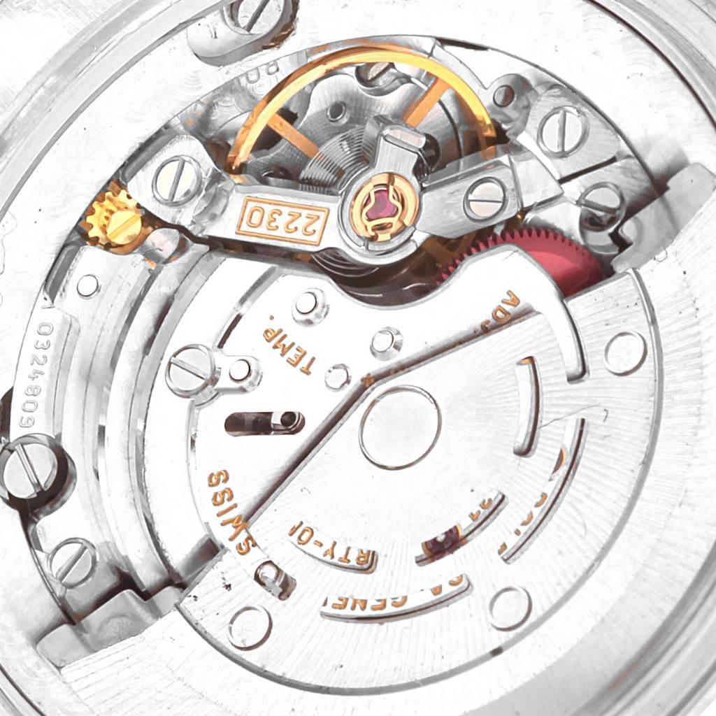 This close-up image shows the movement of a Rolex Mid-Size 77080 Women's Stainless Steel Silver Dial 77080 Women's Stainless Steel Silver Dial model watch, focusing on the intricate internal components.