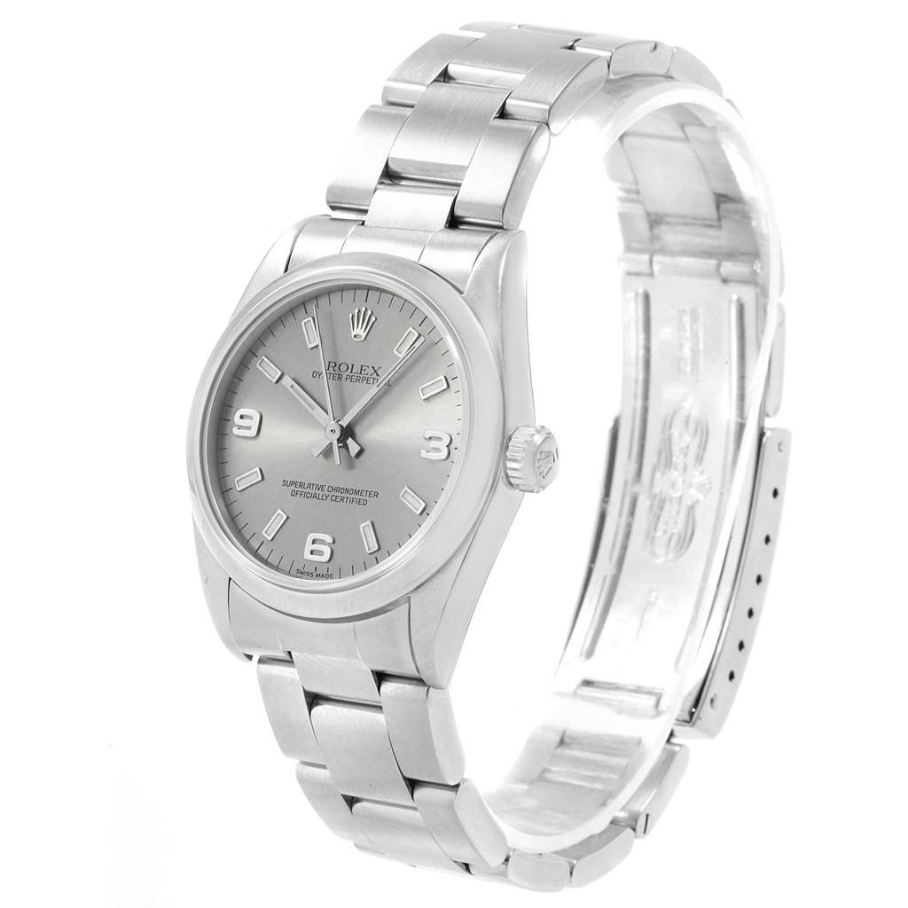 The image shows a Rolex Mid-Size 77080 Women's Stainless Steel Silver Dial 77080 Women's Stainless Steel Silver Dial model watch at a three-quarter angle, highlighting the dial, bezel, and bracelet.