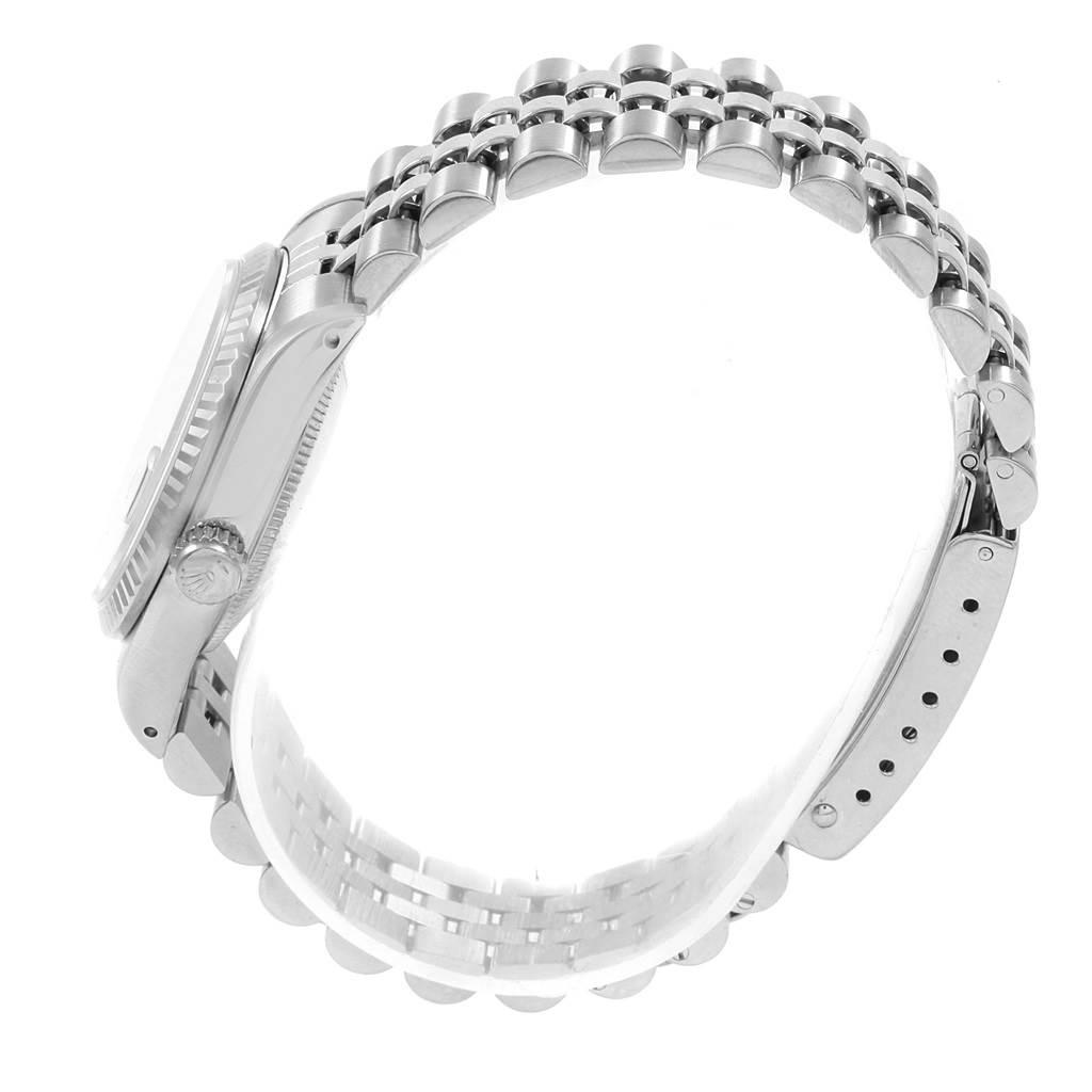 The image shows a side view of a Mid-Size Rolex watch, highlighting the bracelet, clasp, and the watch case
s side profile.