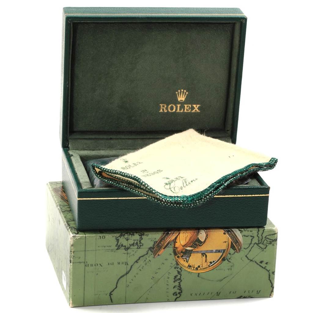 The image shows a green Rolex box with a cleaning cloth inside, likely for the Rolex Mid-Size 68274 Women
s Stainless Steel Black Dial 68274 Women
s Stainless Steel Black Dial model.