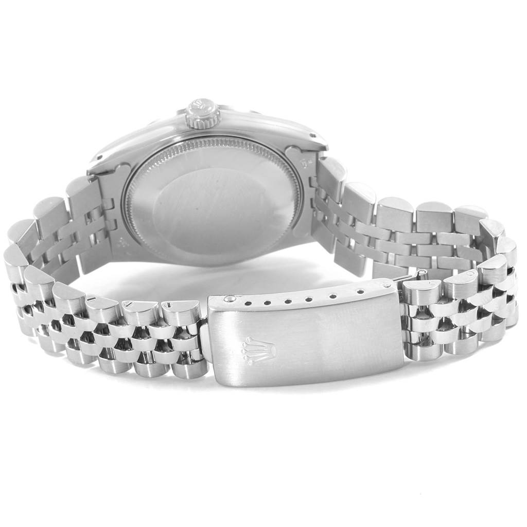 This image shows the back case, crown, and bracelet clasp of a Rolex Mid-Size 68274 Women
s Stainless Steel Black Dial 68274 Women
s Stainless Steel Black Dial model watch from a rear angle.