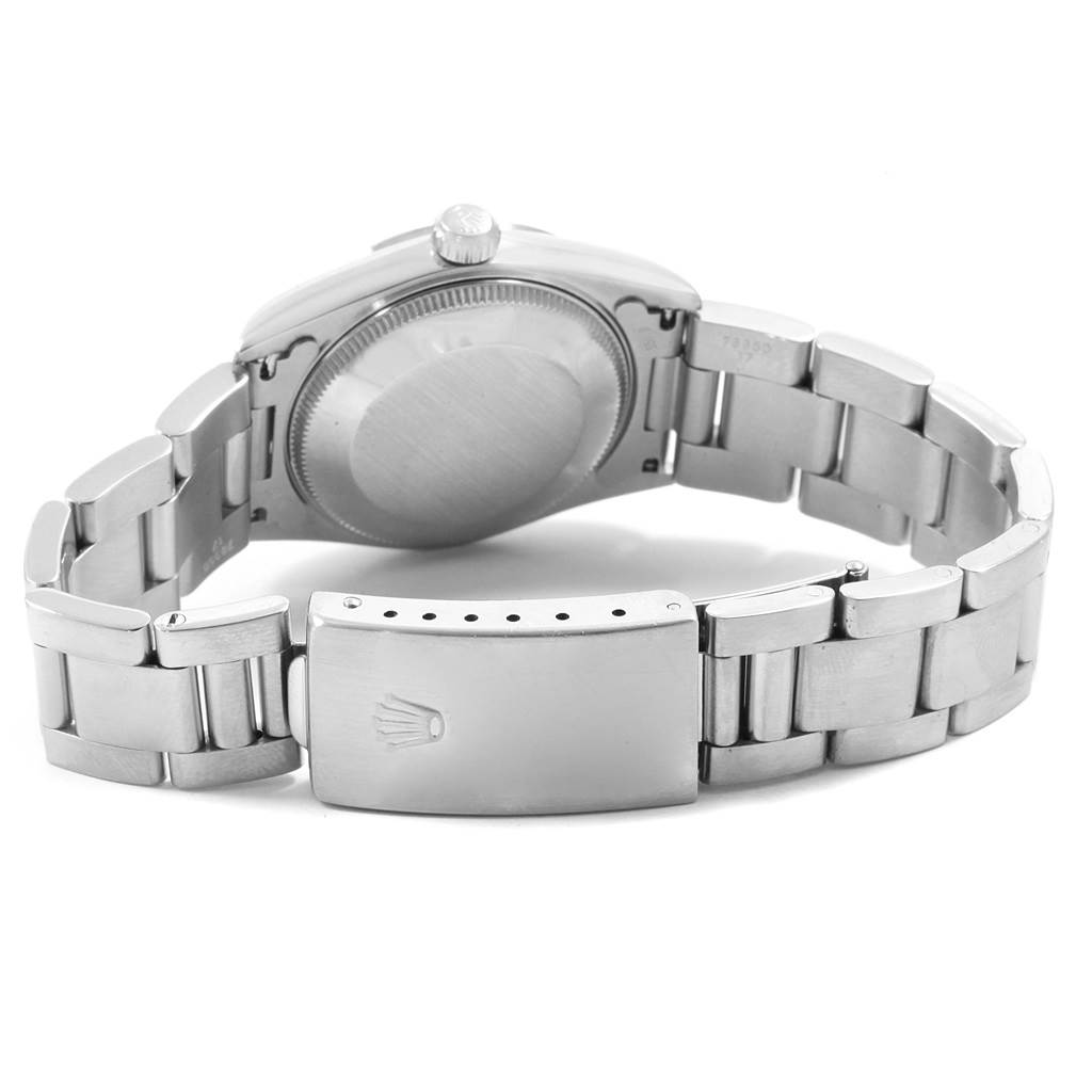 The image shows the back of the Rolex Mid-Size 68240 Women's Stainless Steel White Dial 68240 Women's Stainless Steel White Dial watch, highlighting the clasp and the case back.