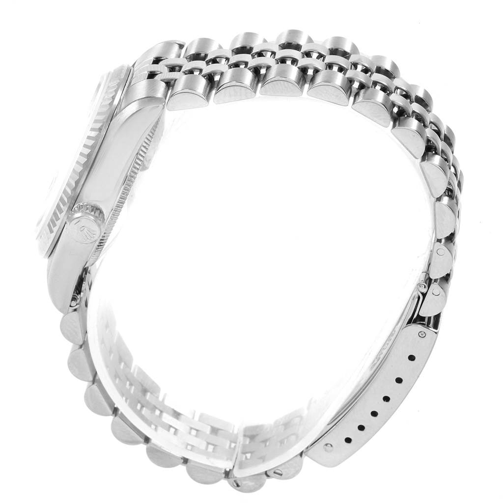 This image shows the side view of a Rolex Mid-Size 68274 Women's Stainless Steel Pink Dial 68274 Women's Stainless Steel Pink Dial watch, highlighting the case, bezel, and bracelet with visible clasp details.