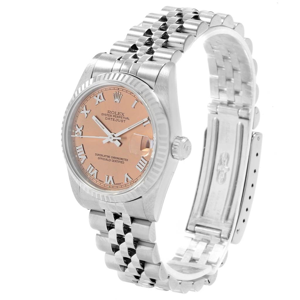 This image shows a Rolex Datejust Mid-Size watch at a slight angle, highlighting the face, bezel, and metal bracelet.