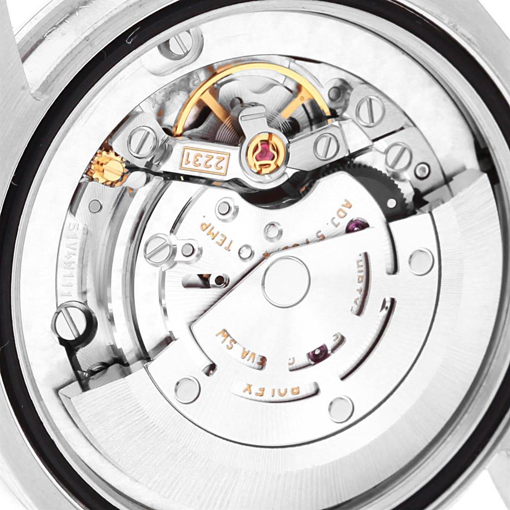 The image shows the internal movement components of a Mid-Size Rolex watch from a rear angle.