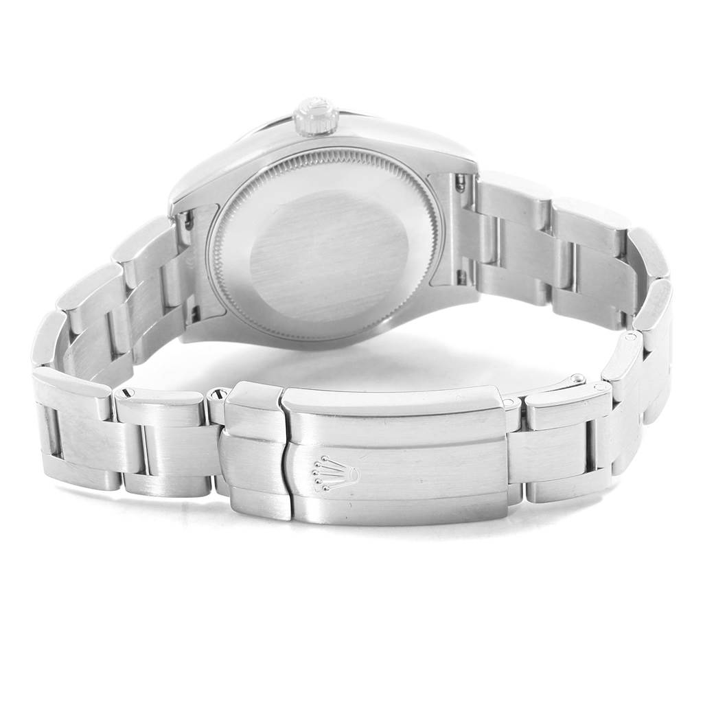 The image shows the back view and bracelet of a Mid-Size Rolex watch, featuring a stainless steel case and clasp.