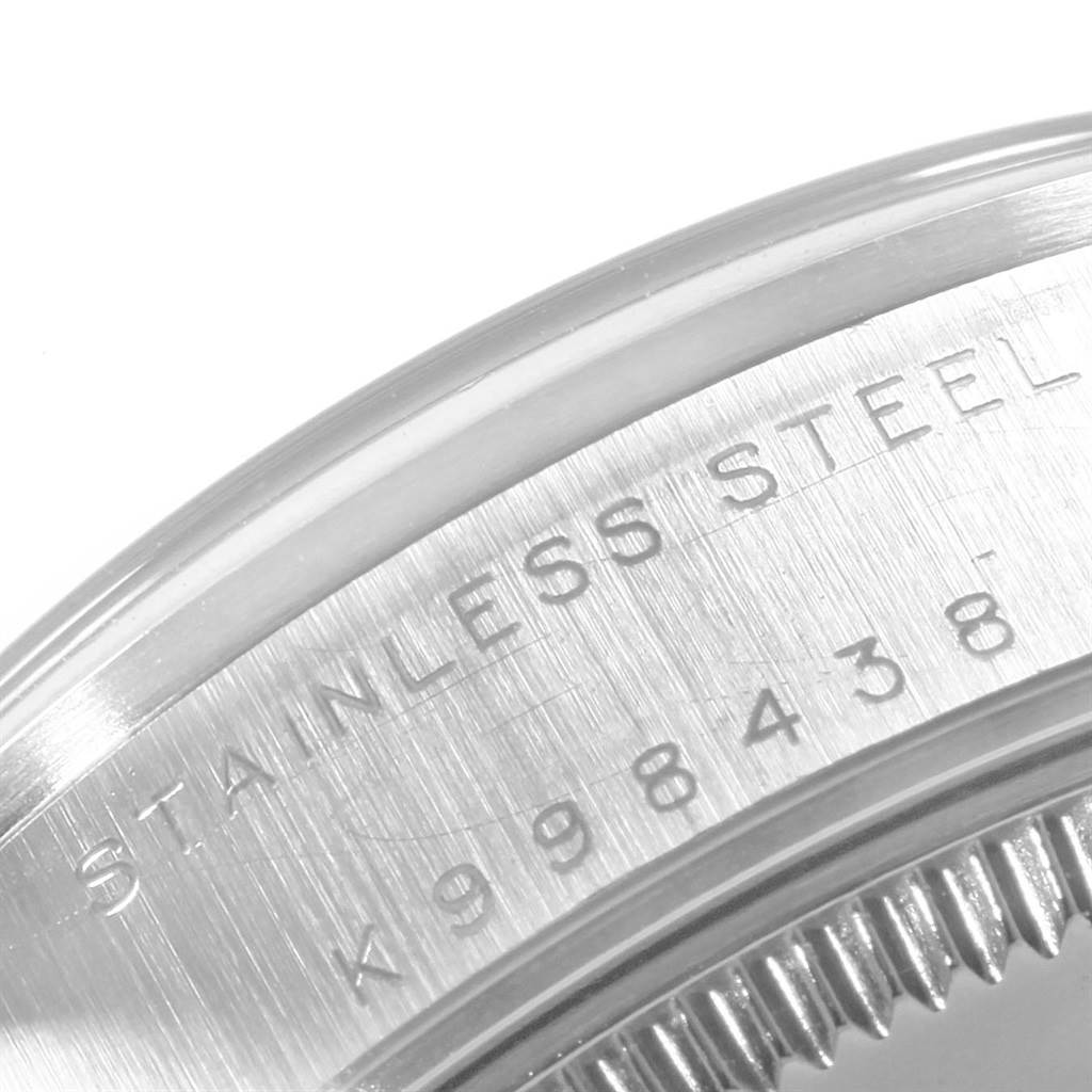 The image shows a macro shot of the stainless steel back casing with serial engraving on a Rolex Mid-Size 78240 Women's Stainless Steel Silver Dial 78240 Women's Stainless Steel Silver Dial model.