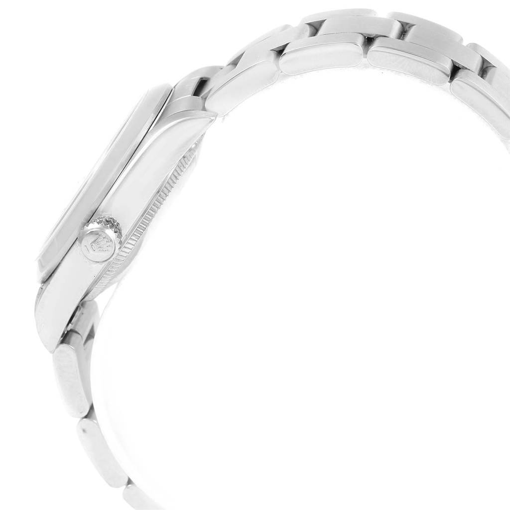 The image shows a side view of a Mid-Size Rolex watch, highlighting the crown and part of the bracelet.