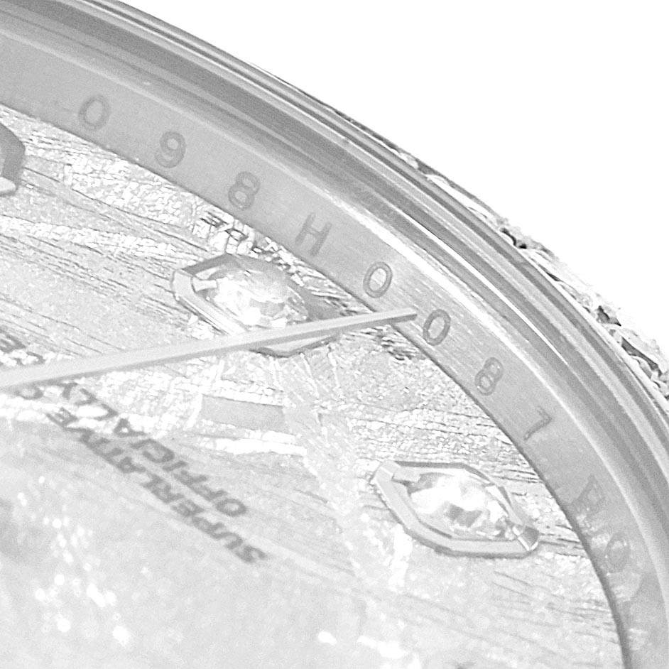 This is a close-up shot of the Rolex Mid-Size 178384 Women's Stainless Steel Silver Dial 178384 Women's Stainless Steel Silver Dial watch, focusing on the dial and minute hand, showcasing the detailed craftsmanship.