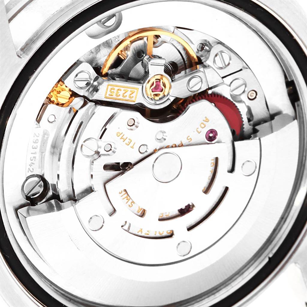 This image shows the inner mechanical movement of a Mid-Size Rolex watch, viewed from the back.
