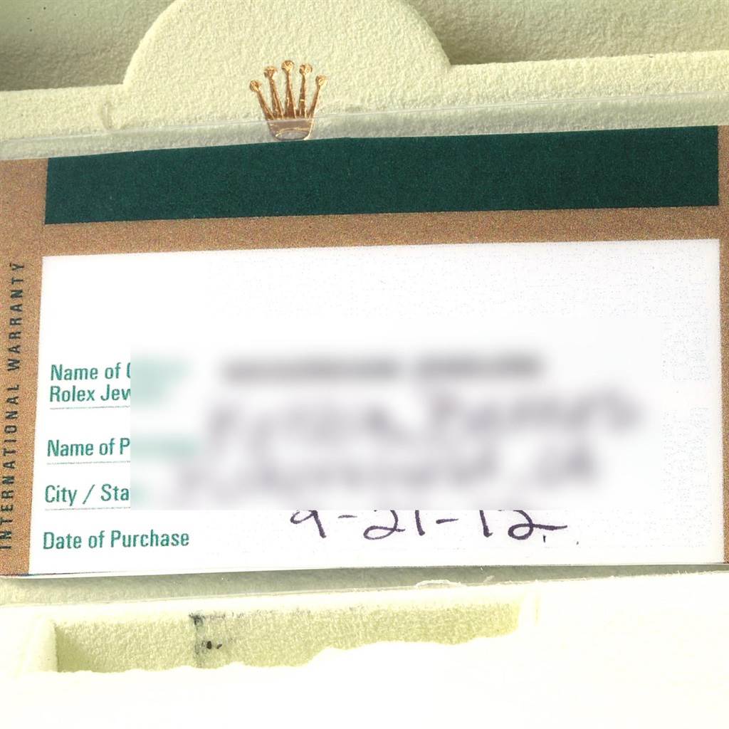 This image shows a close-up of the warranty card for a Mid-Size model Rolex watch, with brand details visible.