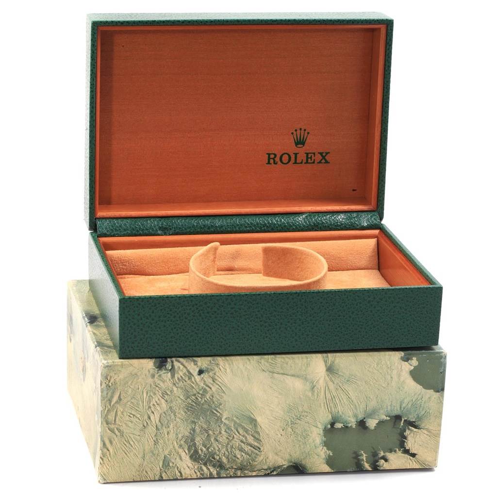 This image shows the opened green case and display cushion for a Mid-Size Rolex watch from a front angle.