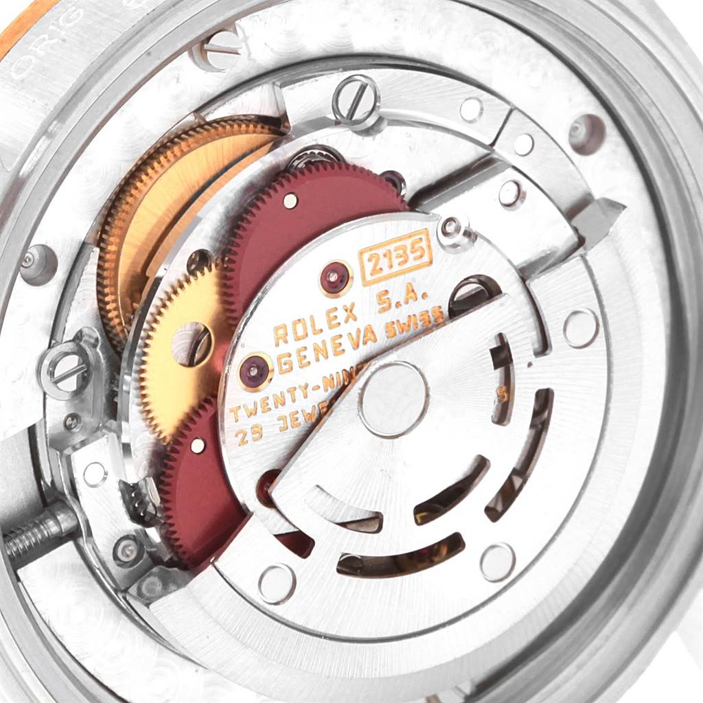 This image shows the internal movement mechanism of a Rolex Mid-Size 68273 Women
s Steel and Gold (two tone) Champagne Dial 68273 Women
s Steel and Gold (two tone) Champagne Dial watch, model 2135, viewed from a close-up angle.