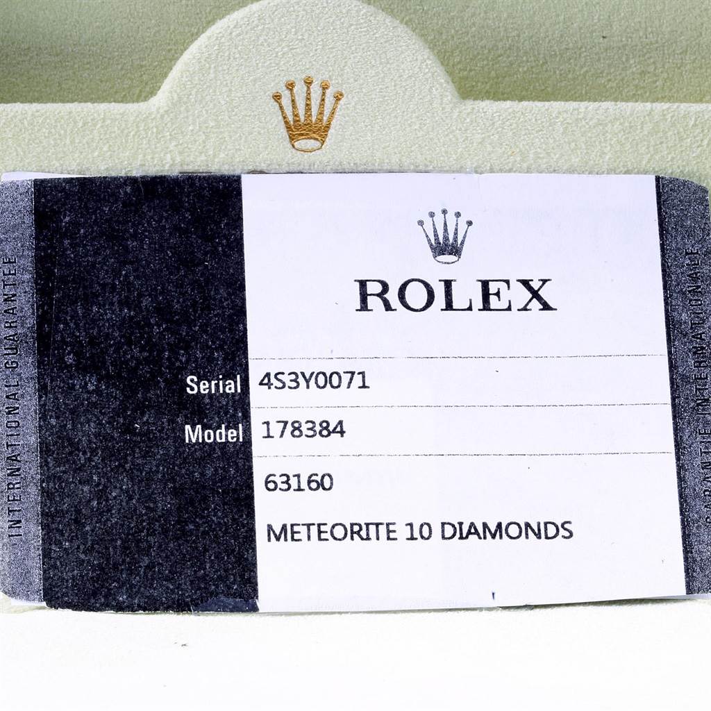 The image shows a close-up of a Rolex Mid-Size 178384 Men's Stainless Steel Silver Dial 178384 Men's Stainless Steel Silver Dial watch tag, detailing the serial, model number (178384), and specifying "Meteorite 10 Diamonds."
