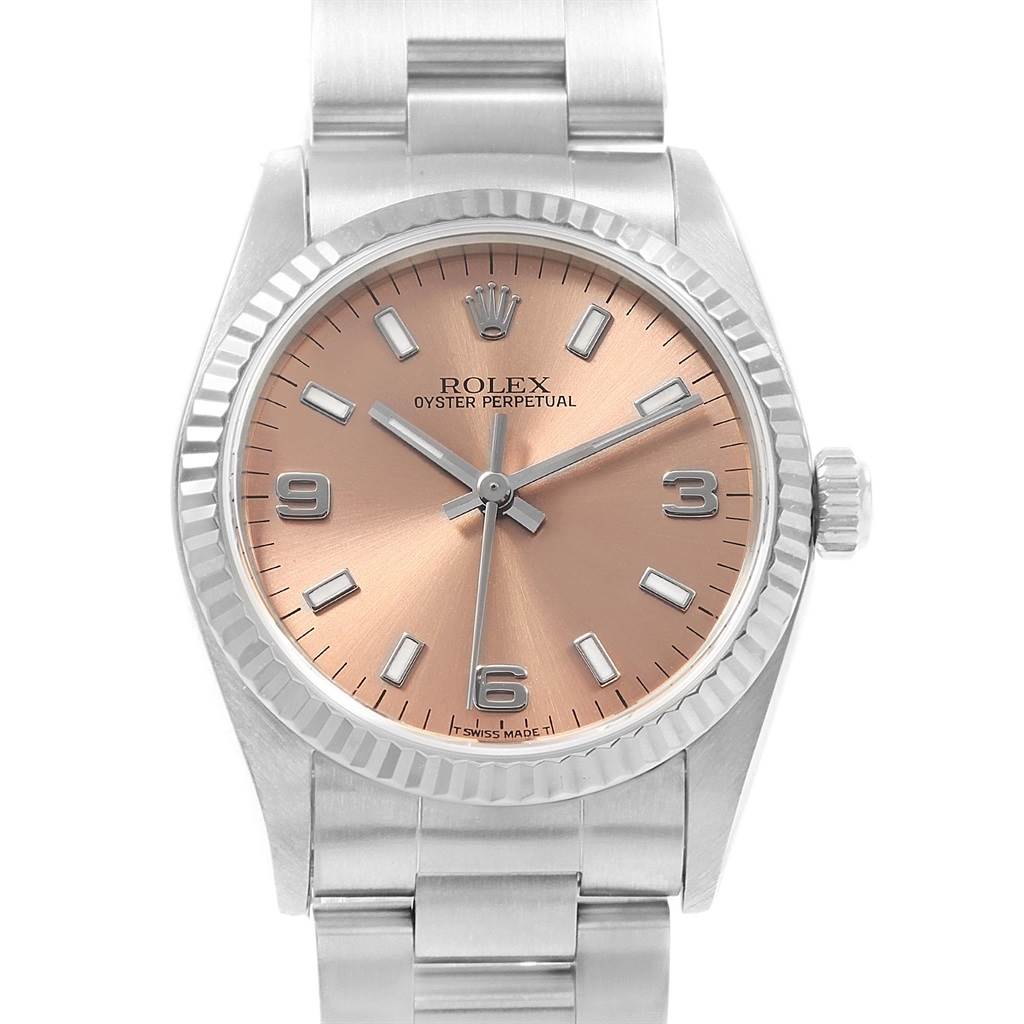 The image shows a front view of a Rolex Oyster Perpetual Mid-Size watch with a silver bracelet and a rose gold dial.