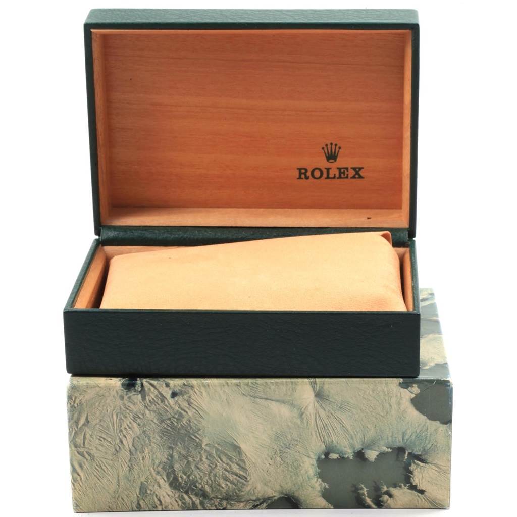 The image shows an open Rolex watch box for a Mid-Size model, revealing its interior cushion and outer packaging.