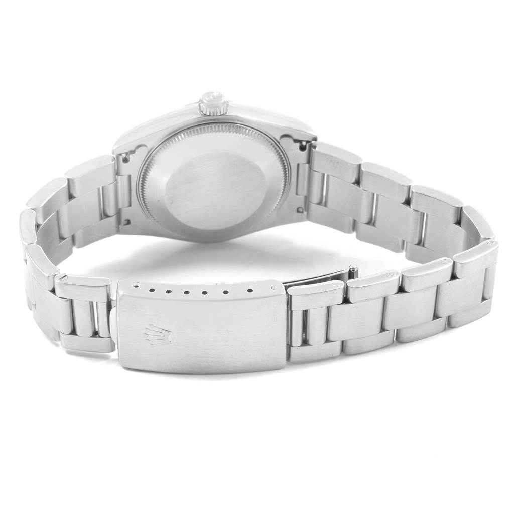 This image shows the backside and bracelet of a Rolex Mid-Size 67514 Women
s Stainless Steel Pink Dial 67514 Women
s Stainless Steel Pink Dial watch.