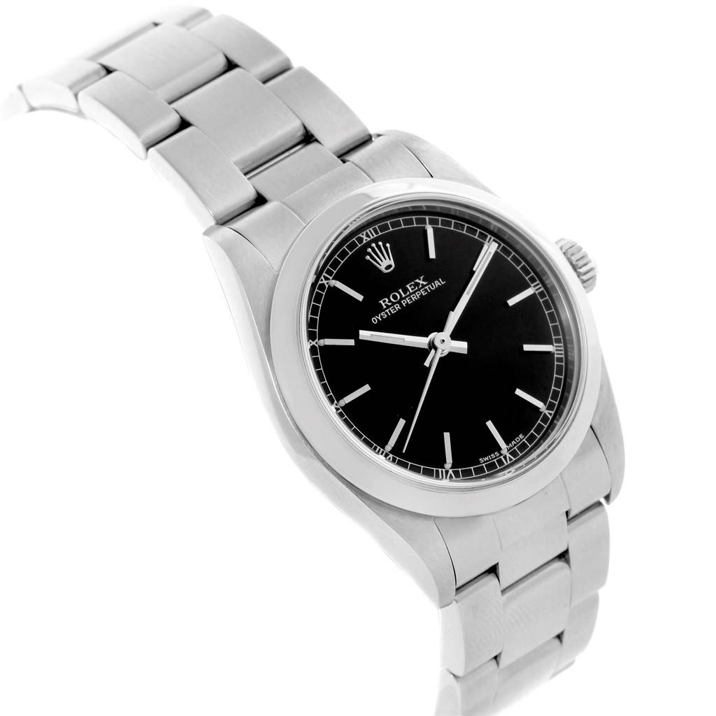 The image shows a Rolex Oyster Perpetual Mid-Size watch from a side angle, displaying the bracelet, case, and black dial.