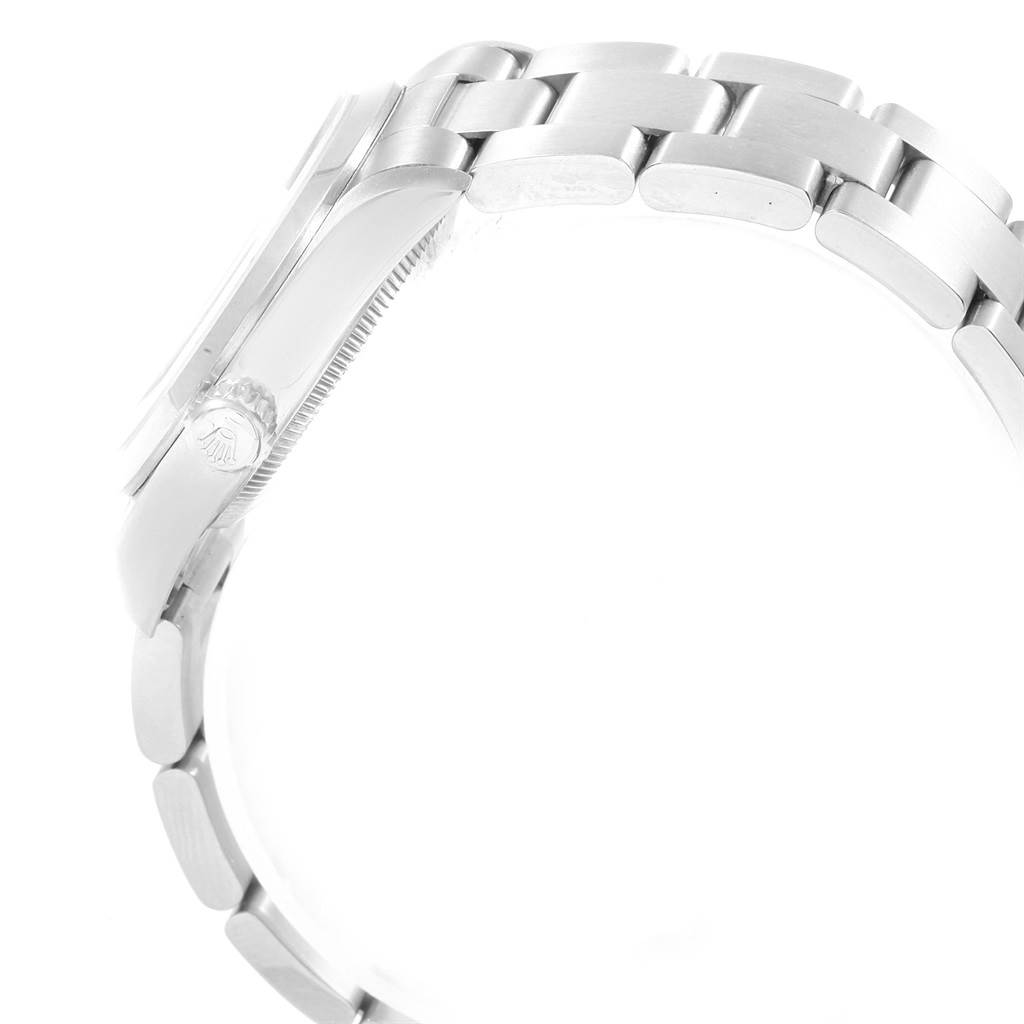 The image shows the side profile and bracelet of a Rolex Mid-Size 67480 Women's Stainless Steel Pink Dial 67480 Women's Stainless Steel Pink Dial model watch, focusing on the link design and crown.