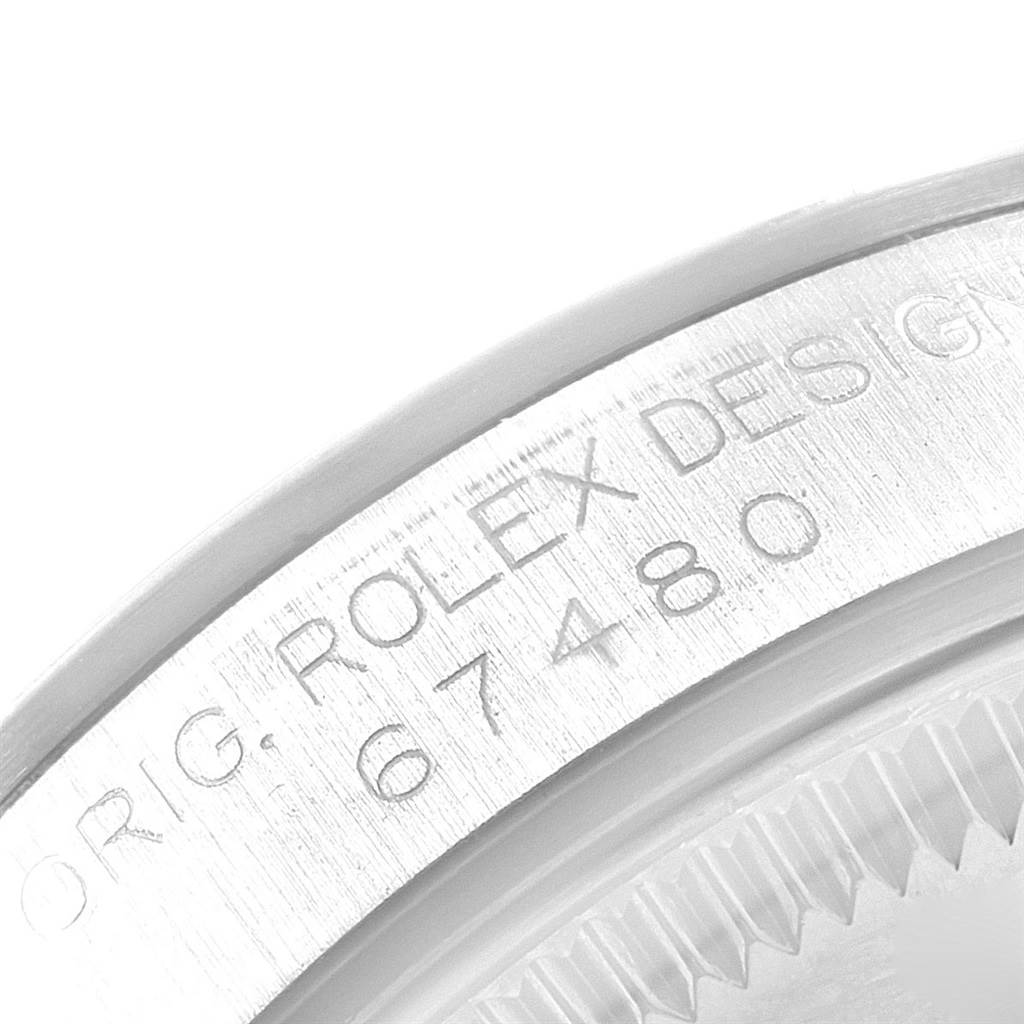The image shows a close-up angle of the watch case engraving for the Mid-Size model by Rolex, displaying the design number 67480.