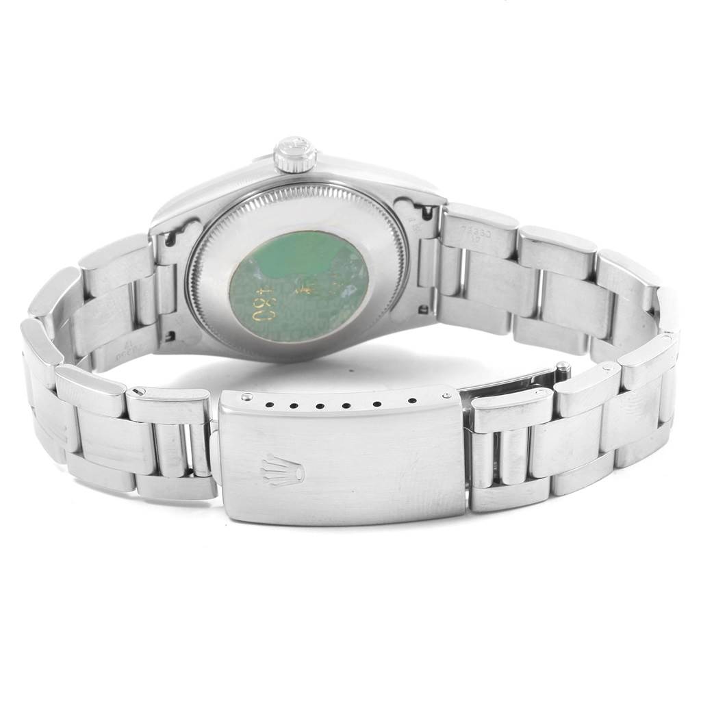 This Mid-Size Rolex watch is shown from the back, highlighting the case back and clasp.