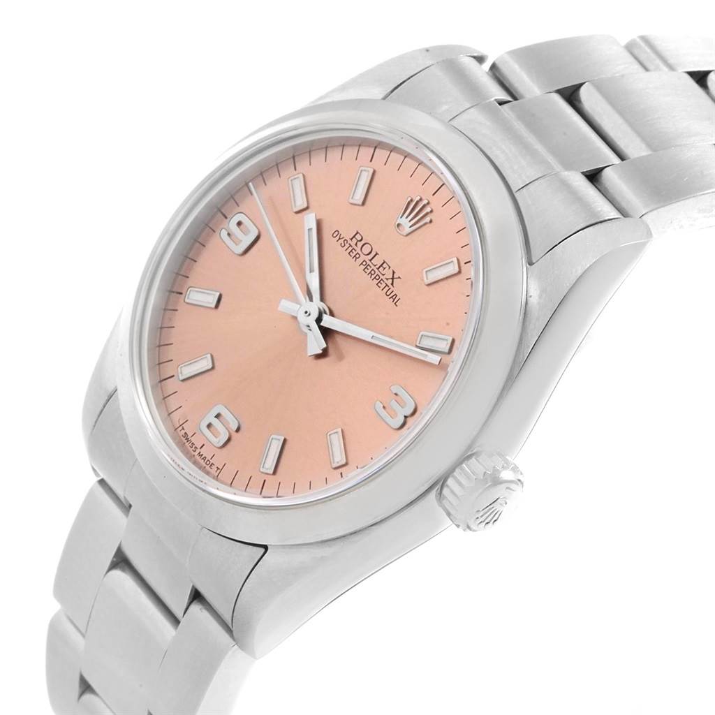 This image shows a Rolex Oyster Perpetual Mid-Size watch from a three-quarter angled view, highlighting its dial, case, and bracelet.