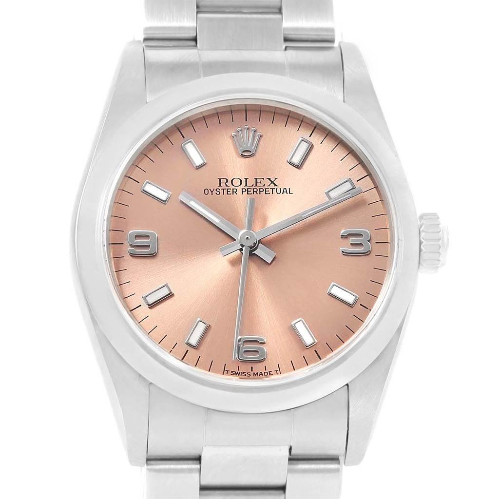 This image shows the front view of a Rolex Oyster Perpetual Mid-Size watch with a metal bracelet and pinkish dial.