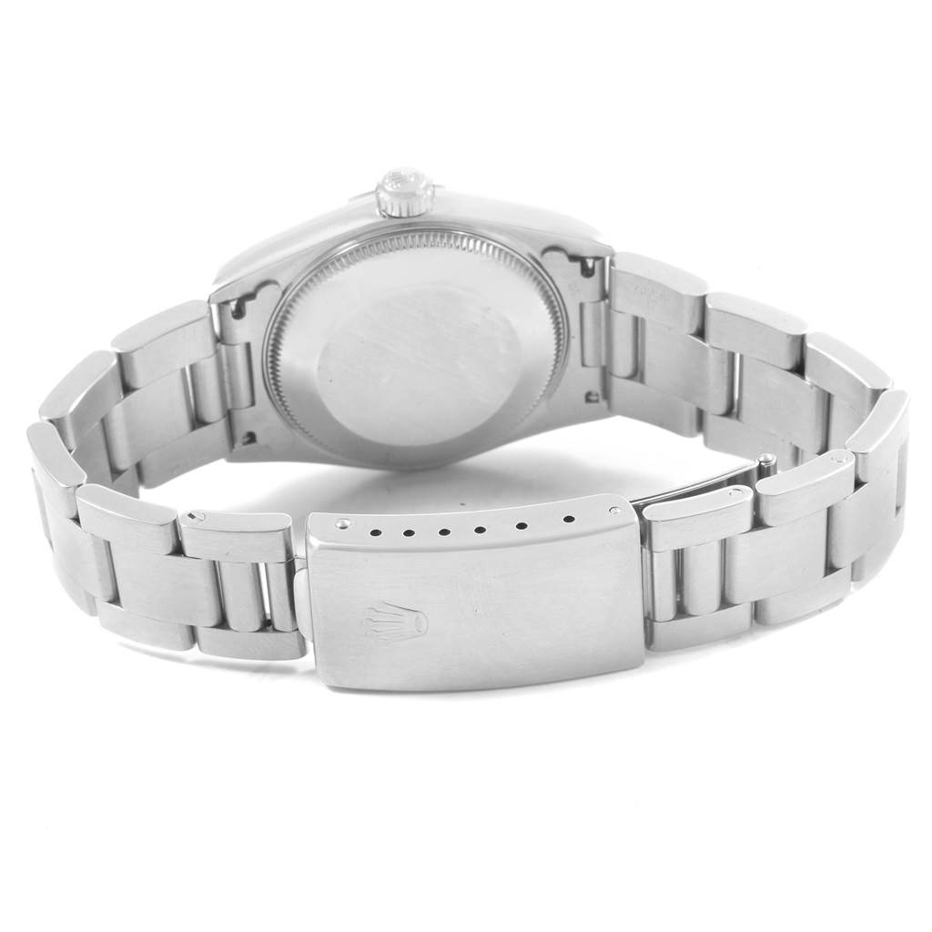 This image shows the back case and bracelet with the clasp of the Rolex Mid-Size 67480 Women's Stainless Steel Pink Dial 67480 Women's Stainless Steel Pink Dial model watch.