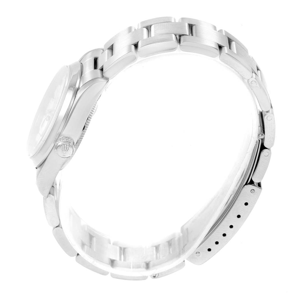 This image shows a side view of the case and bracelet of a Mid-Size Rolex watch.