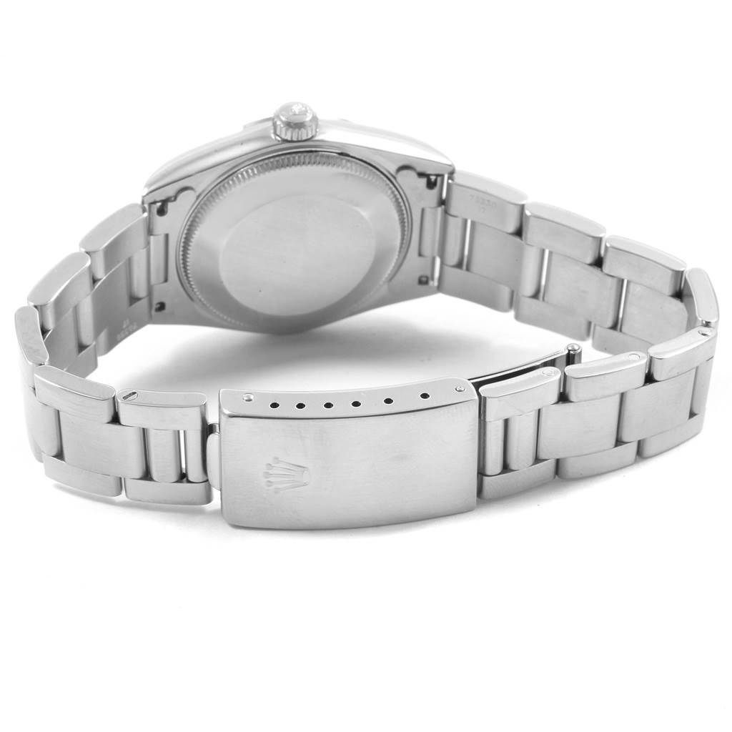 This image shows the back and bracelet clasp of a Mid-Size Rolex watch.