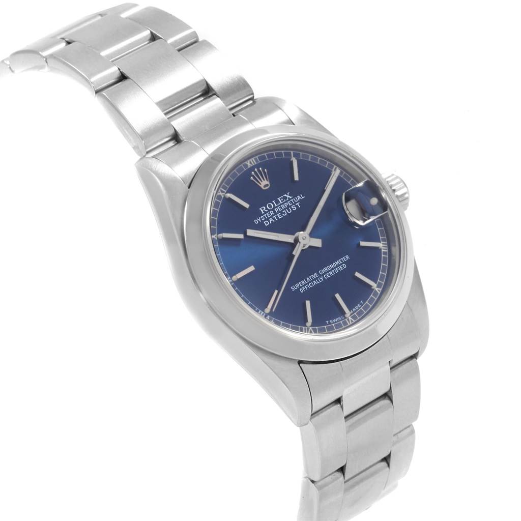 The Rolex Mid-Size 68240 Women's Stainless Steel Blue Dial 68240 Women's Stainless Steel Blue Dial watch is shown at an oblique angle, revealing its blue dial, bezel, crown, and stainless steel bracelet.