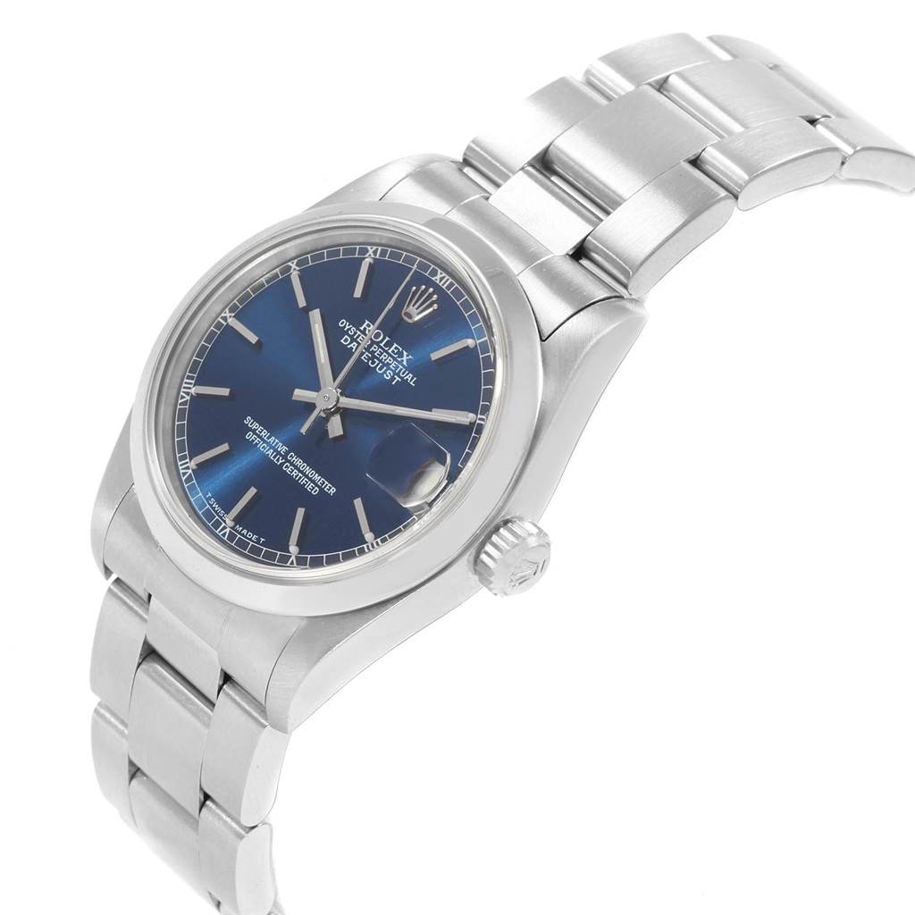 The watch shown is a Rolex Mid-Size 68240 Women's Stainless Steel Blue Dial 68240 Women's Stainless Steel Blue Dial model with a side angle view displaying the face, crown, and bracelet.