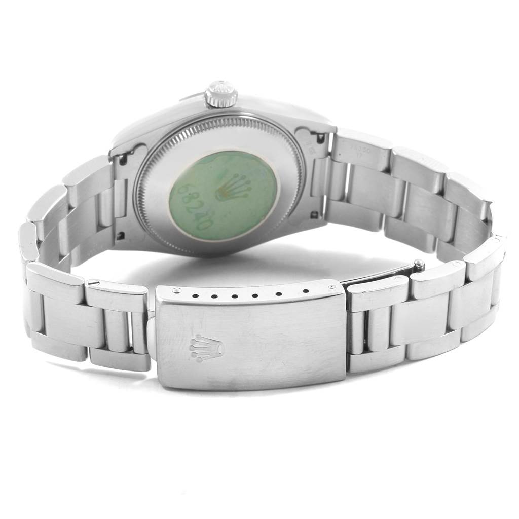 The image shows the back case, bracelet, and clasp of a Mid-Size Rolex watch, viewed from the rear.