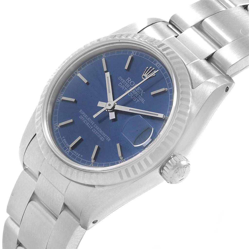 The image shows a Rolex Mid-Size 68274 Women's Stainless Steel Blue Dial 68274 Women's Stainless Steel Blue Dial Oyster Perpetual Datejust watch angled to display its blue dial, crown, and bracelet.