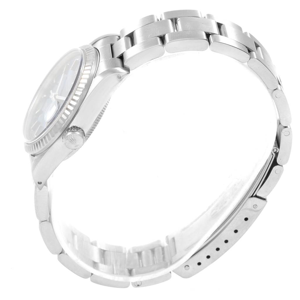 The image shows a side view of a mid-size Rolex watch, highlighting its bracelet, case, and crown.