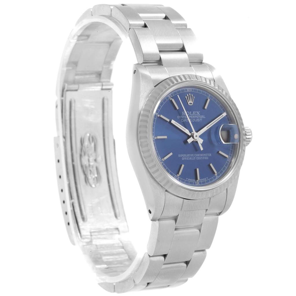 The Rolex Mid-Size 68274 Women's Stainless Steel Blue Dial 68274 Women's Stainless Steel Blue Dial model is shown from a front angle, displaying the blue dial, bracelet, and partially opened clasp.