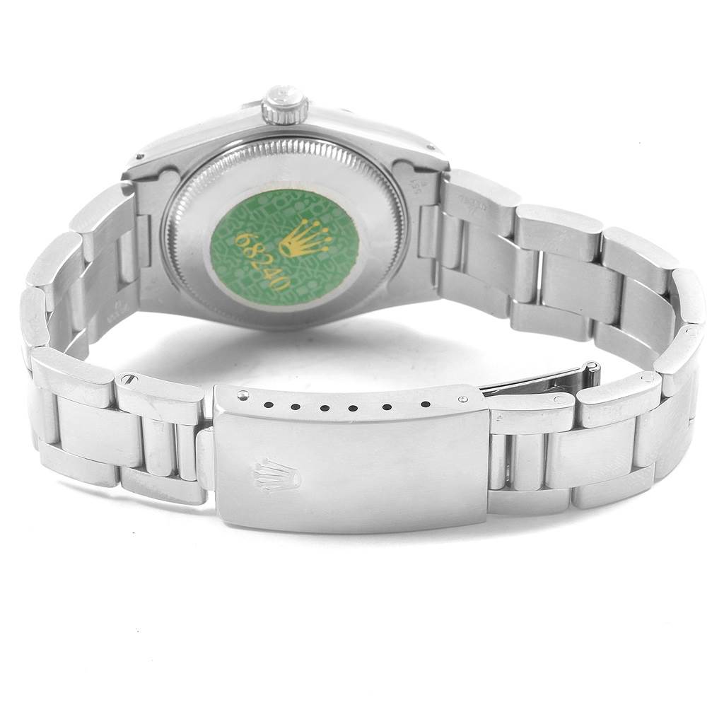 This image shows the backside and clasp of a Mid-Size Rolex watch.