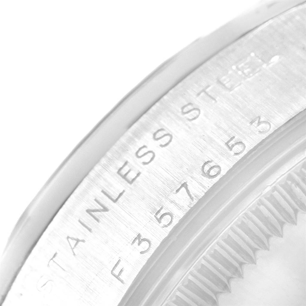 The image shows a close-up view of the bezel edge and part of the outer casing of a Rolex Mid-Size 77080 Women's Stainless Steel Black Dial 77080 Women's Stainless Steel Black Dial watch.