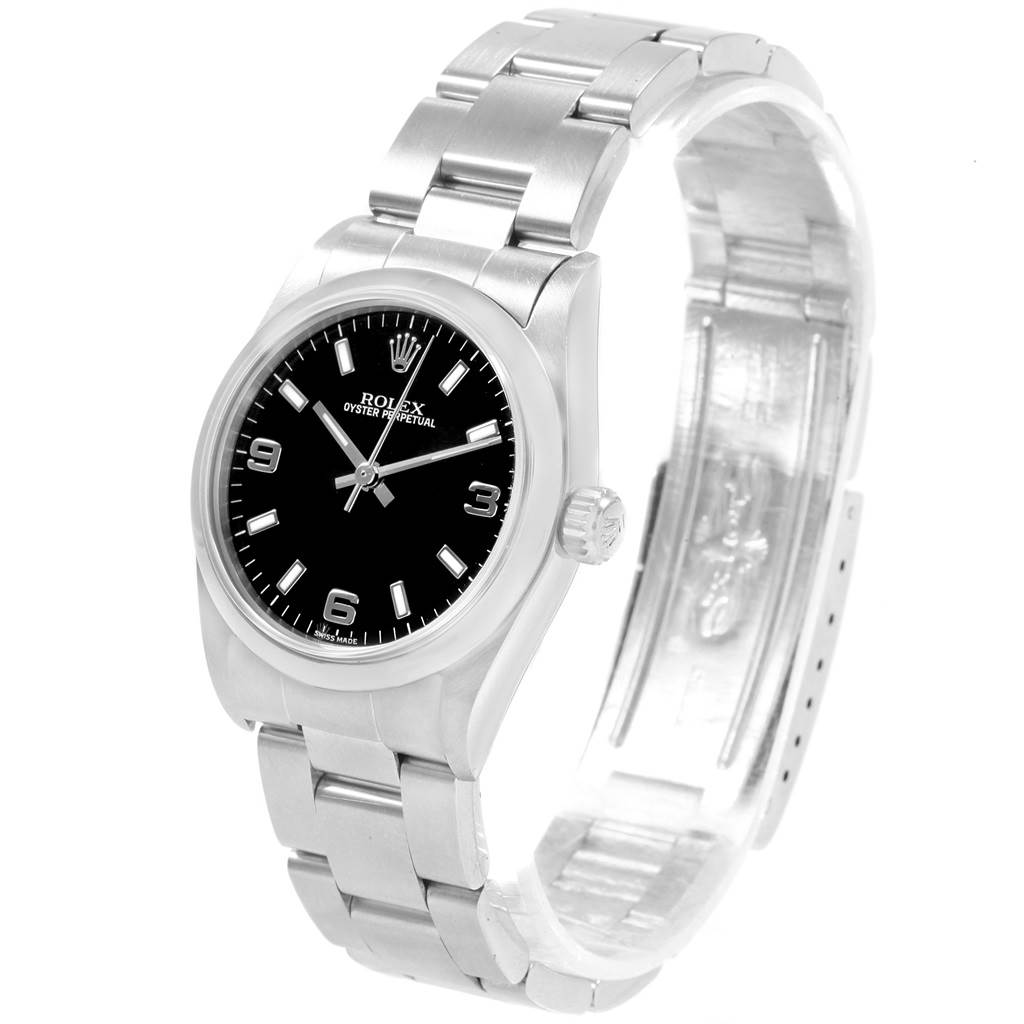 The Mid-Size Rolex watch is shown from a front angle, highlighting its face, bezel, and stainless steel band.