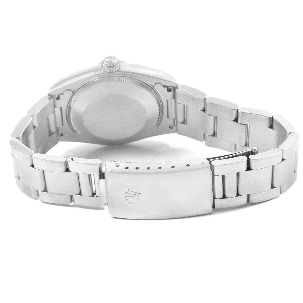 The image shows the back of a Rolex Mid-Size 77080 Women's Stainless Steel Black Dial 77080 Women's Stainless Steel Black Dial watch, including the bracelet and clasp with the Rolex logo.