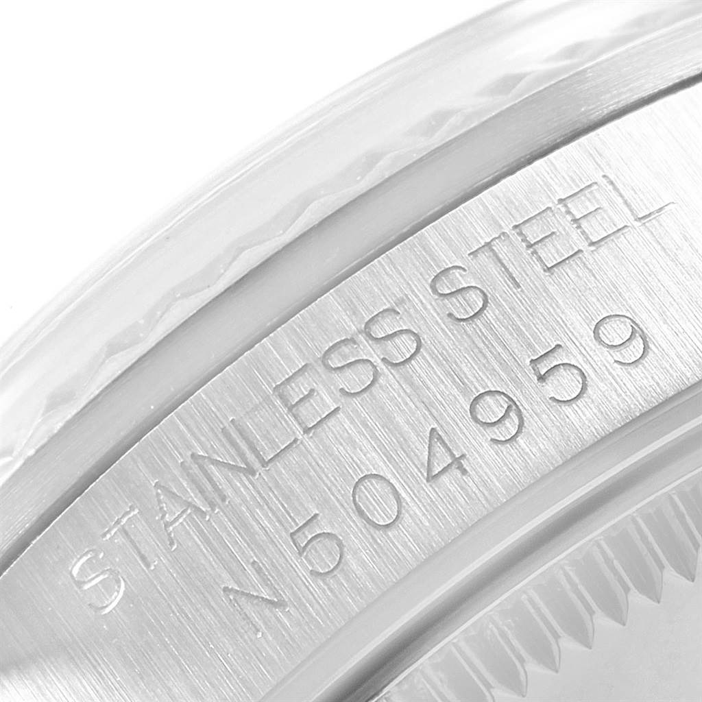This image shows a close-up view of the stainless steel case back, possibly detailing the serial number of the mid-size Rolex watch.