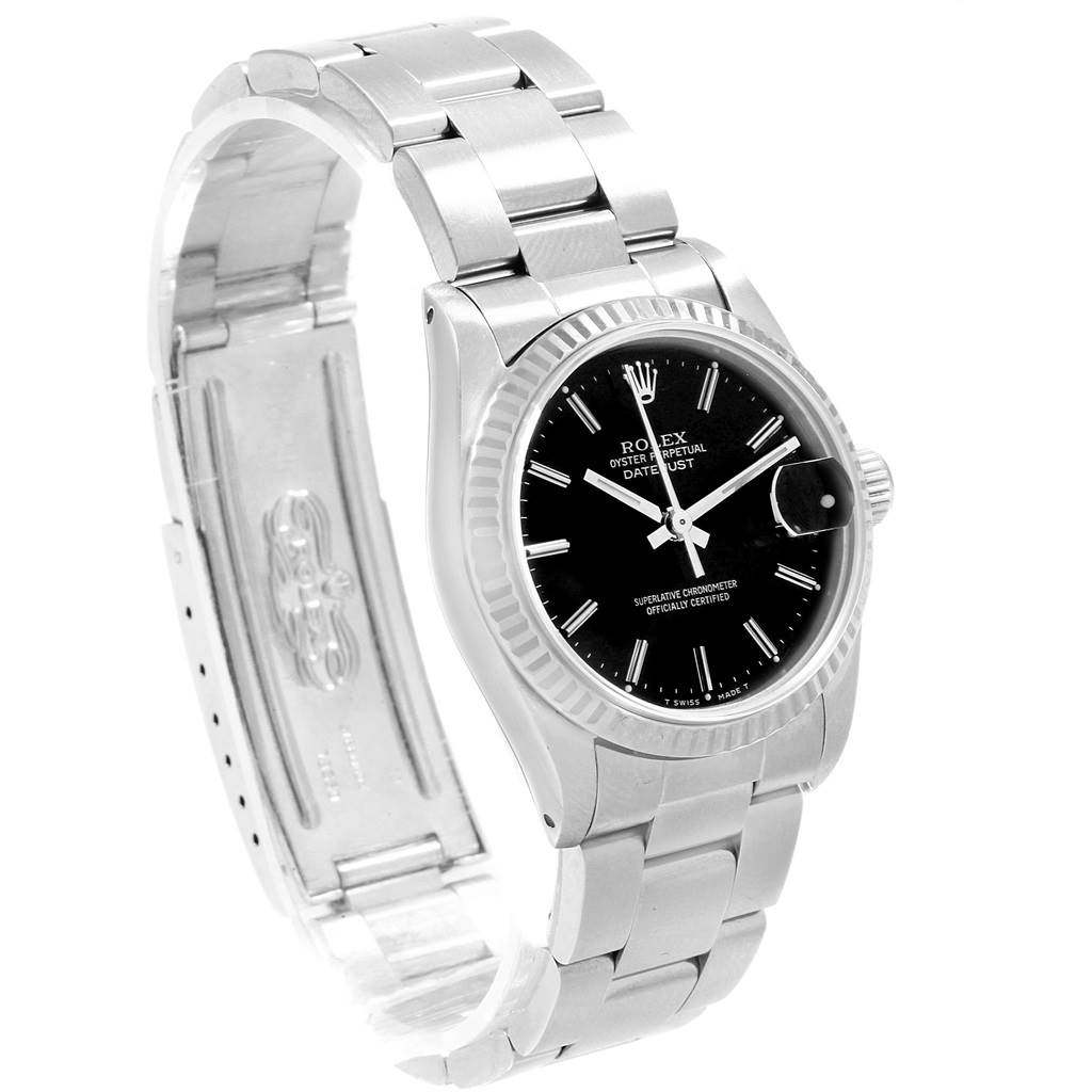 The image shows a Rolex Mid-Size 68274 Women's Stainless Steel Black Dial 68274 Women's Stainless Steel Black Dial Datejust watch at a slight angle, displaying its bracelet, clasp, and black dial with fluted bezel.
