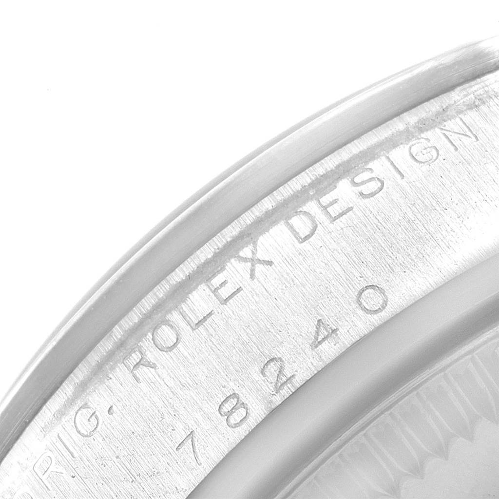 This image shows the side view of a Mid-Size model Rolex watch case back, featuring engraved text.