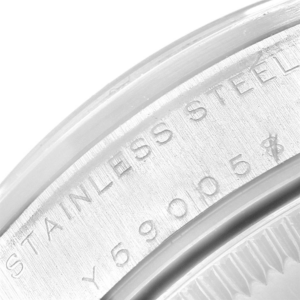 This is a close-up view of the case back of a Mid-Size Rolex watch, focusing on the engraved model and serial numbers.