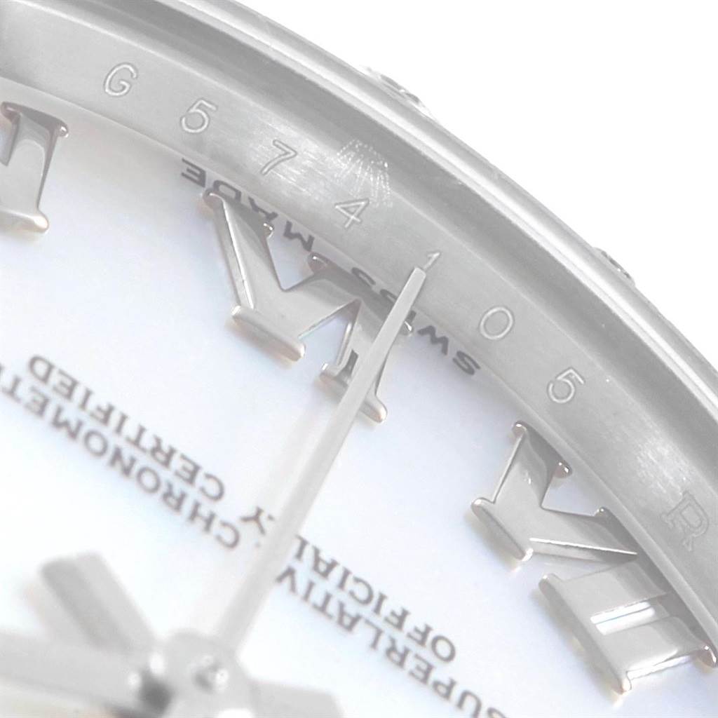 The image shows a close-up of the face and indices near the edge of a Rolex Mid-Size 178344 Women's Stainless Steel Mother of Pearl Dial 178344 Women's Stainless Steel Mother of Pearl Dial model watch.
