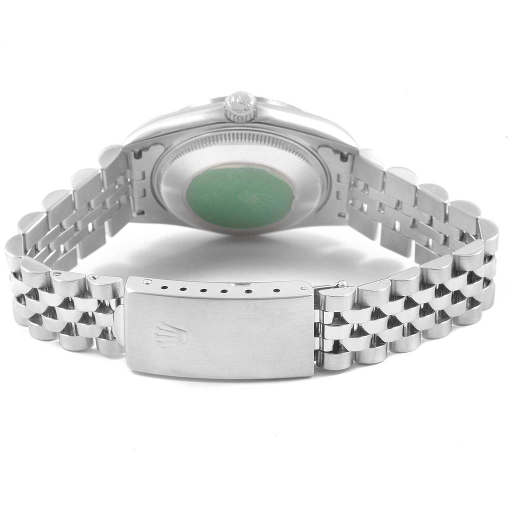 The image shows the back of a Rolex Mid-Size 68274 Women
s Stainless Steel Blue Dial 68274 Women
s Stainless Steel Blue Dial watch with its clasp and bracelet in view.